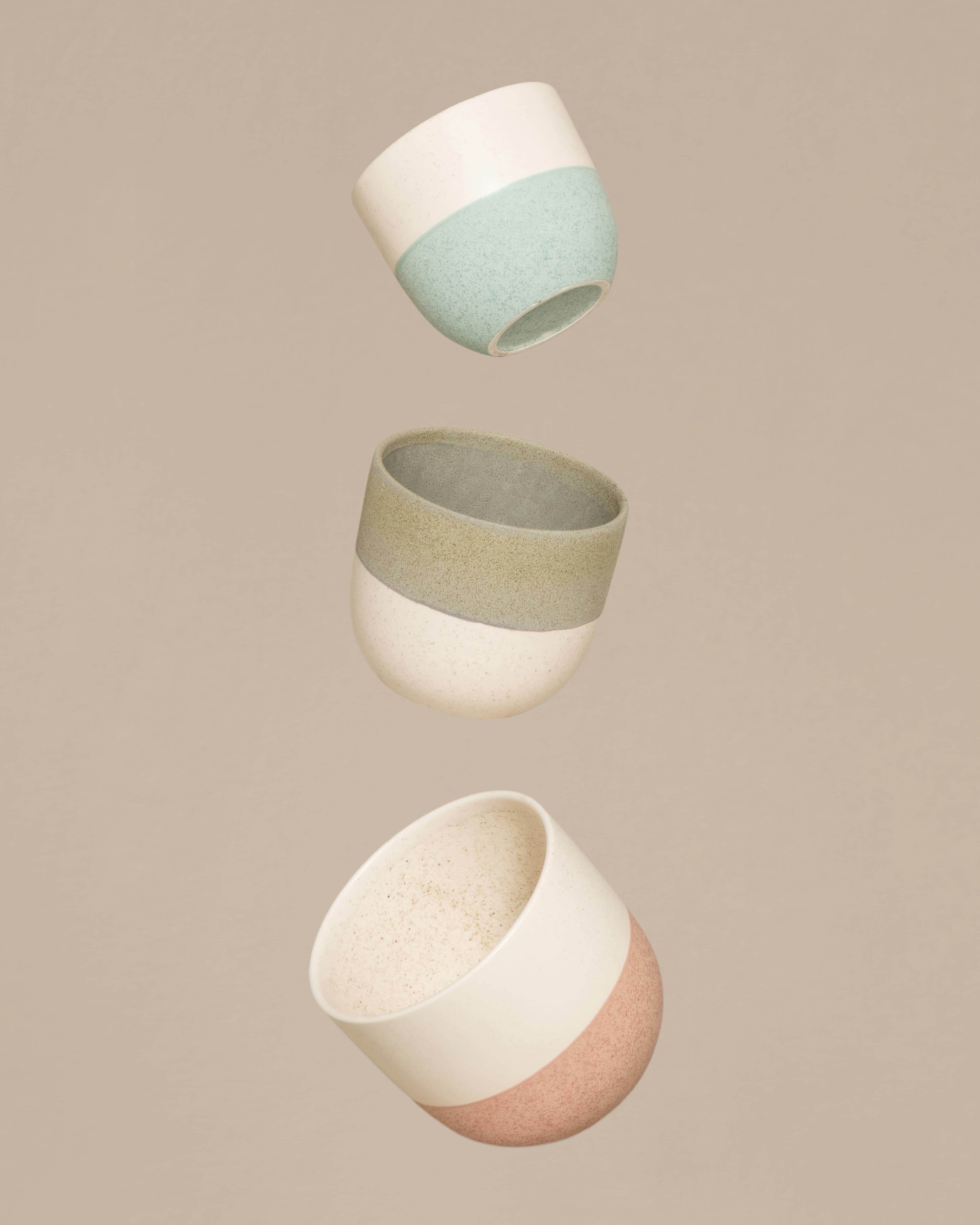 Three pots floating in midair